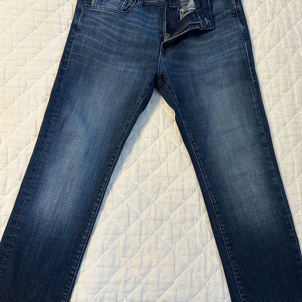 Men's Blue Jeans. Buckle Brand.